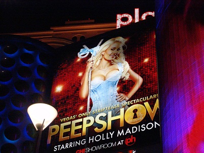 sign showing holly madison in reveling top