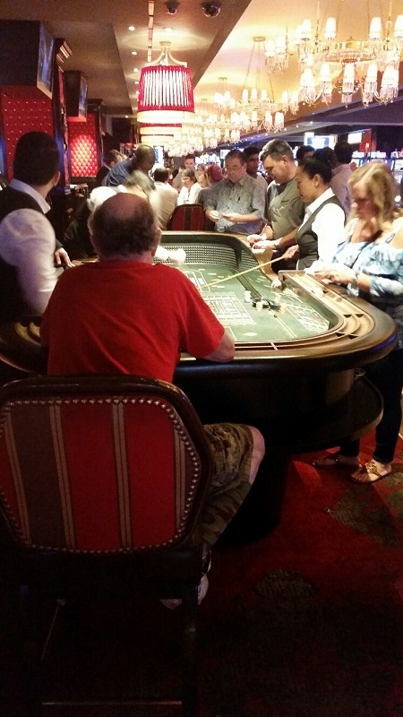 You can sit in a chair and play at the traditional Craps Table