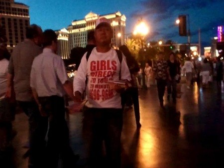 las vegas escorts handing out materials on the las vegas strip