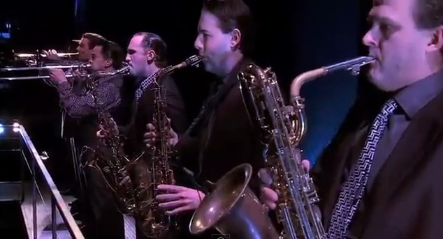 sax and trumpets and other instruments behind the jersey boy Le Theatre Des Arts - Paris Hotel