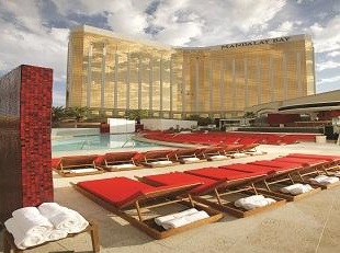 swimming pool with hotel in backgroun