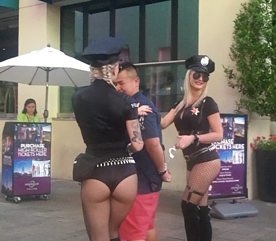 A man getting a spanking from sexy police